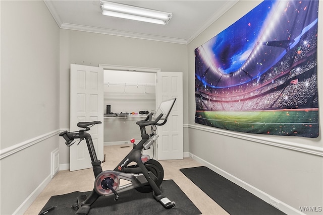 exercise area featuring light carpet and crown molding