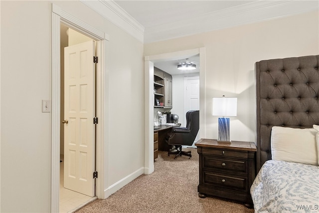 carpeted bedroom featuring connected bathroom and ornamental molding