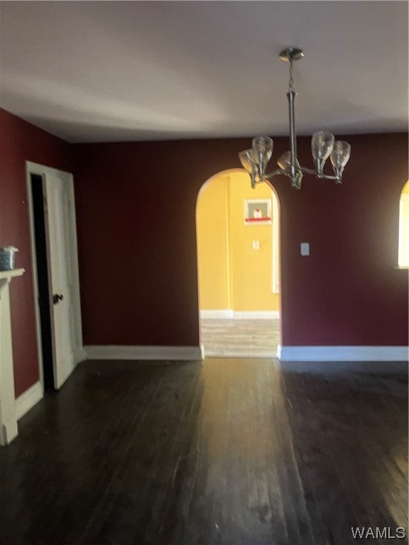 unfurnished room featuring dark hardwood / wood-style flooring