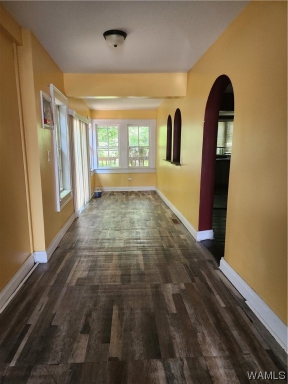 unfurnished room with dark hardwood / wood-style floors