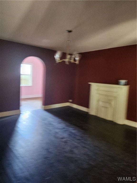 unfurnished dining area with an inviting chandelier