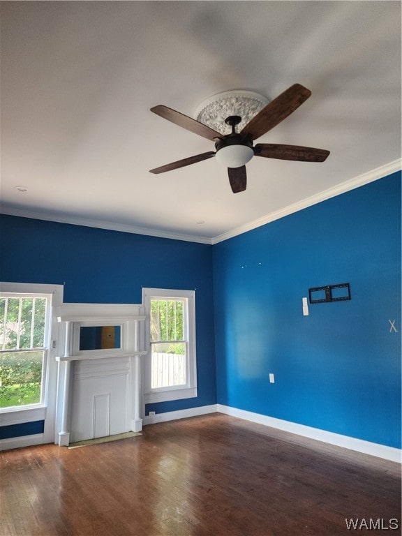 unfurnished living room featuring hardwood / wood-style floors, ceiling fan, and ornamental molding