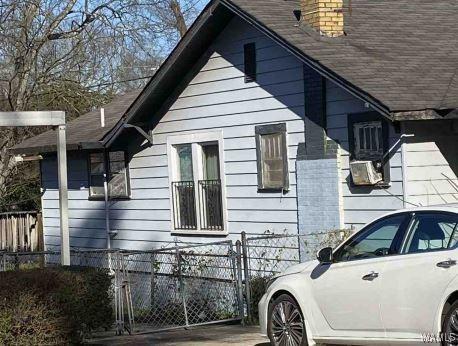 view of side of property with cooling unit