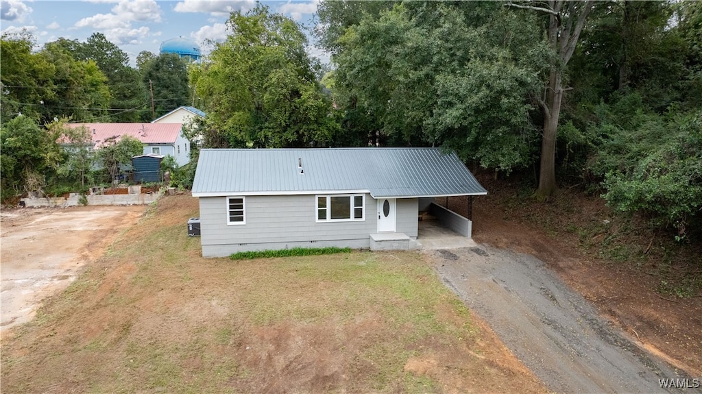 rear view of house featuring a carport