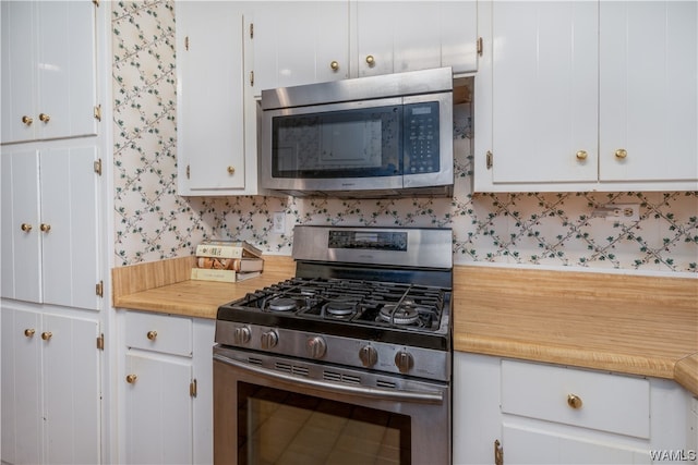 kitchen featuring white cabinetry and stainless steel appliances