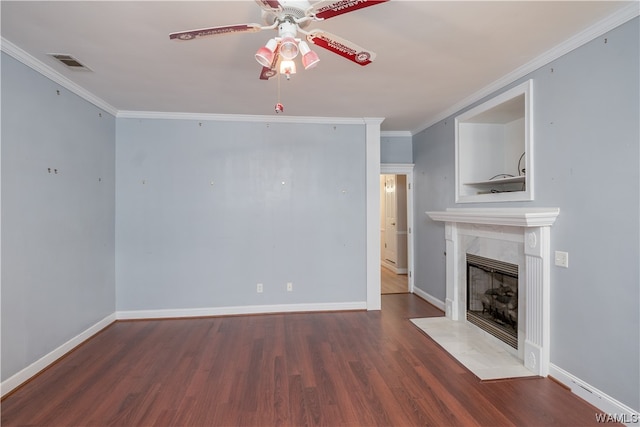 unfurnished living room featuring hardwood / wood-style floors, ceiling fan, ornamental molding, and a premium fireplace