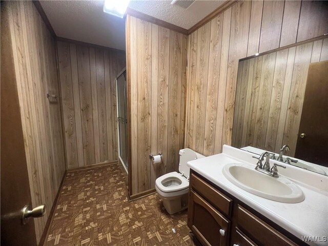 10882 Tingle Tangle Rd, Vance, AL 35490 - bathroom with vanity, a textured ceiling, and wood walls