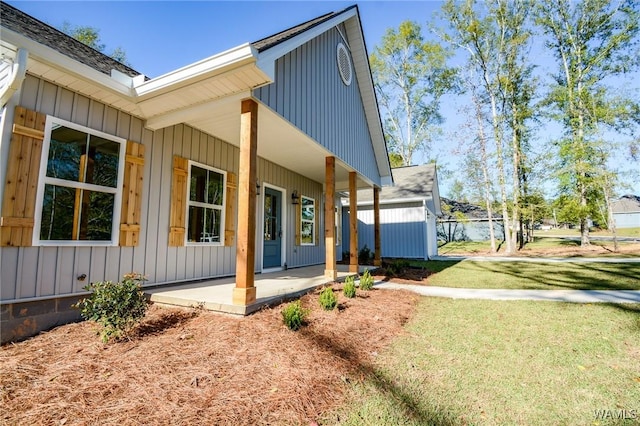 view of property exterior with a porch and a yard