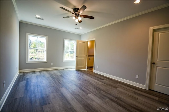 unfurnished bedroom with ornamental molding, ceiling fan, and dark hardwood / wood-style floors