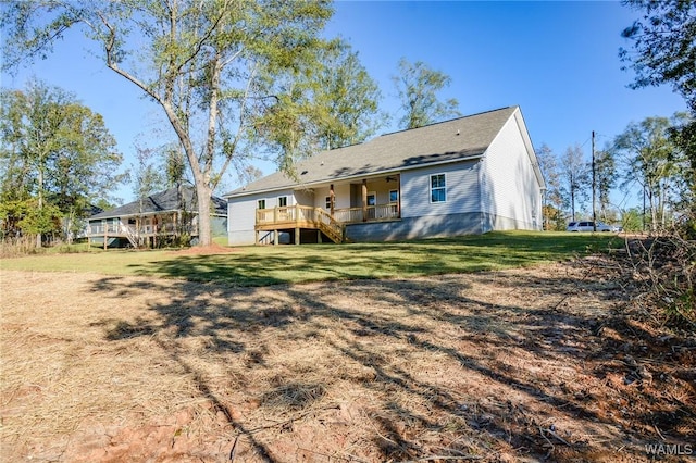 rear view of property with a lawn