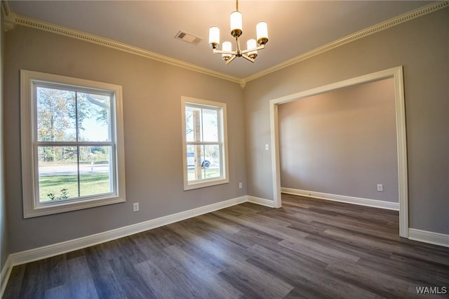 spare room featuring an inviting chandelier, crown molding, and dark hardwood / wood-style floors