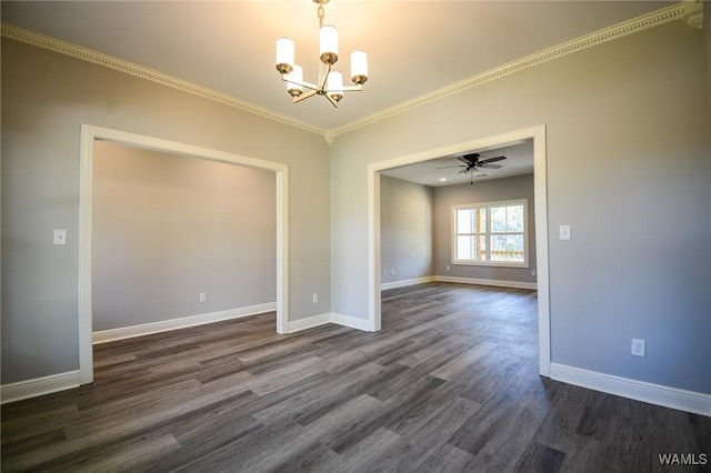 empty room with ceiling fan with notable chandelier, ornamental molding, and dark hardwood / wood-style floors