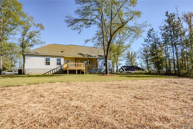 rear view of house with a yard