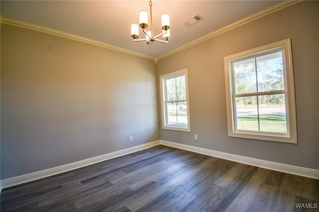 spare room featuring a notable chandelier, dark hardwood / wood-style flooring, and plenty of natural light