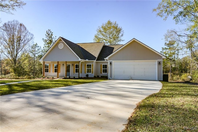 view of front of house featuring a front yard and a garage