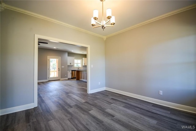 unfurnished room with sink, a chandelier, crown molding, and dark wood-type flooring