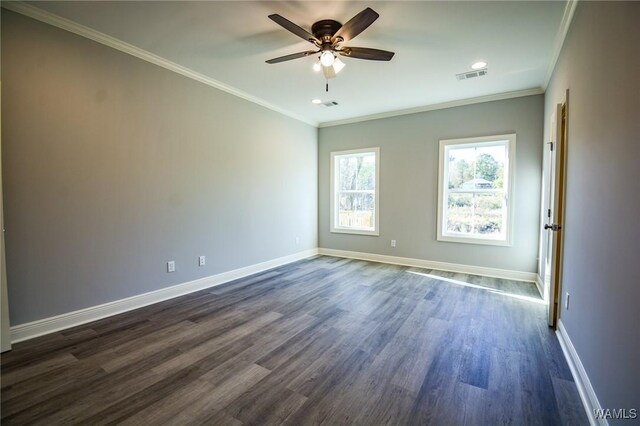 spare room with ceiling fan, ornamental molding, and dark hardwood / wood-style flooring