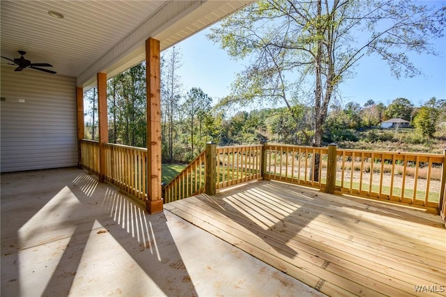 wooden terrace featuring ceiling fan