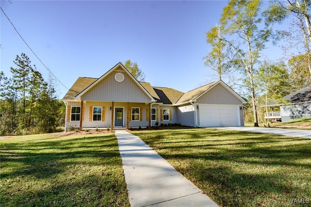 view of front facade featuring a porch, a front lawn, and a garage