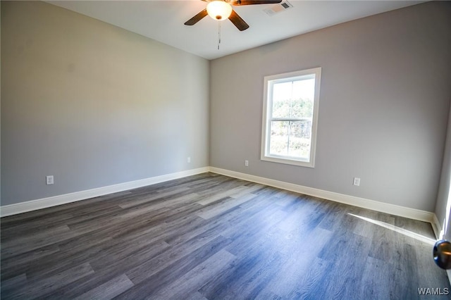 unfurnished room featuring ceiling fan and dark hardwood / wood-style floors