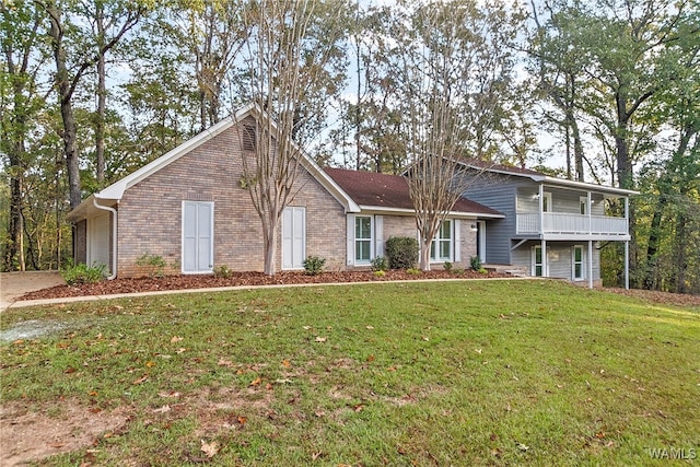 view of front facade featuring a balcony and a front lawn