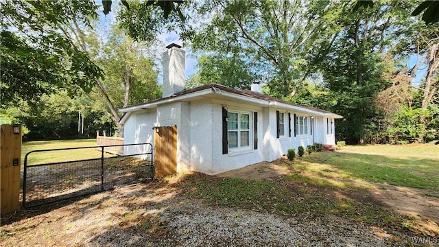 view of property exterior with a yard