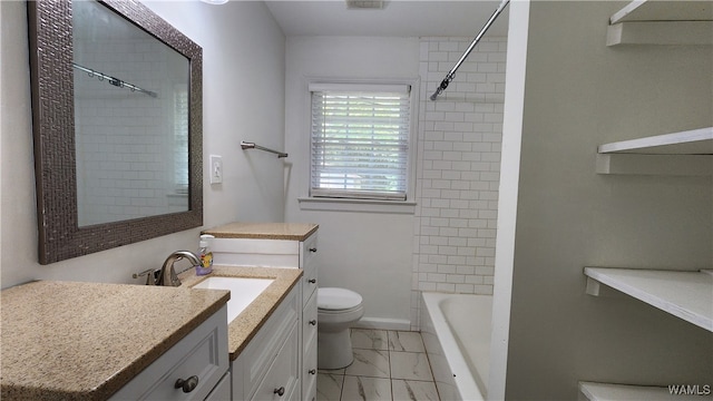 full bathroom featuring vanity, toilet, and tiled shower / bath combo