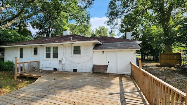 back of property with a deck