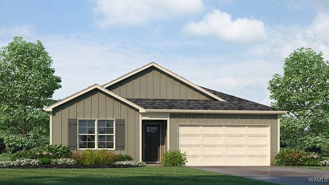 view of front of property with a front lawn and a garage