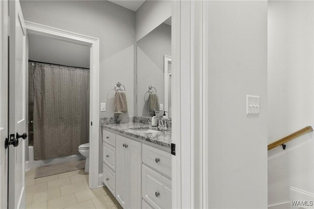 5377 Alexander Ave, Tuscaloosa, AL 35406 - bathroom with vanity, tile patterned floors, and shower / bath combo with shower curtain