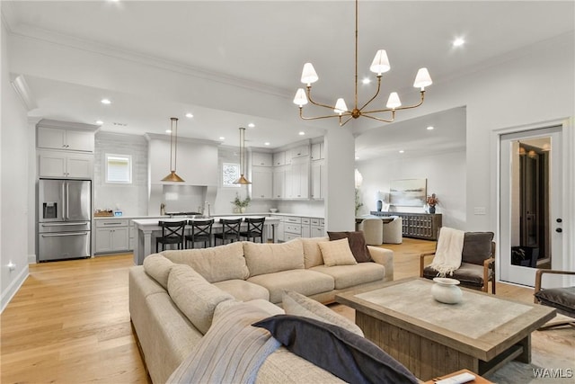 5377 Alexander Ave, Tuscaloosa, AL 35406 - living room featuring ornamental molding, light wood-style flooring, recessed lighting, and a chandelier