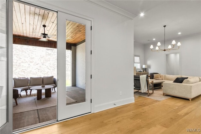 5377 Alexander Ave, Tuscaloosa, AL 35406 - living room featuring light wood-style flooring, a chandelier, recessed lighting, and crown molding