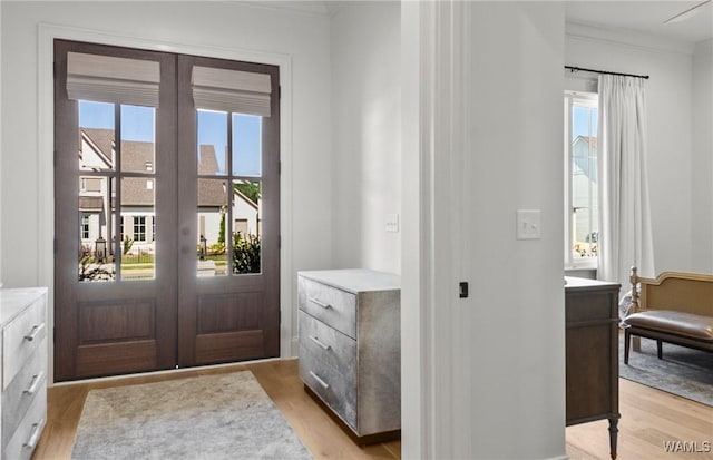 5377 Alexander Ave, Tuscaloosa, AL 35406 - entryway featuring french doors, light wood-style flooring, healthy amount of natural light, and crown molding