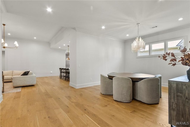 5377 Alexander Ave, Tuscaloosa, AL 35406 - dining area featuring a chandelier, light wood-type flooring, crown molding, and recessed lighting