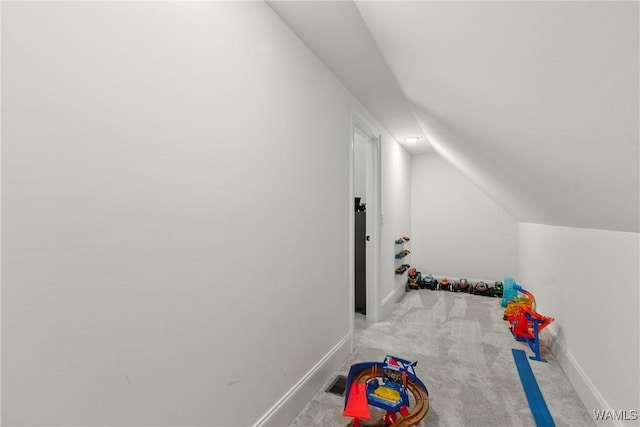 5377 Alexander Ave, Tuscaloosa, AL 35406 - recreation room with carpet floors and vaulted ceiling