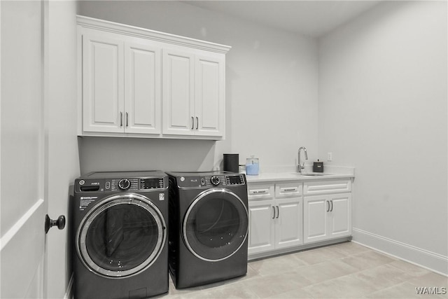 5377 Alexander Ave, Tuscaloosa, AL 35406 - laundry room with cabinet space and washer and clothes dryer