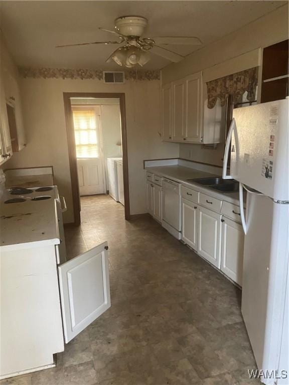 kitchen featuring ceiling fan, white cabinetry, and white appliances