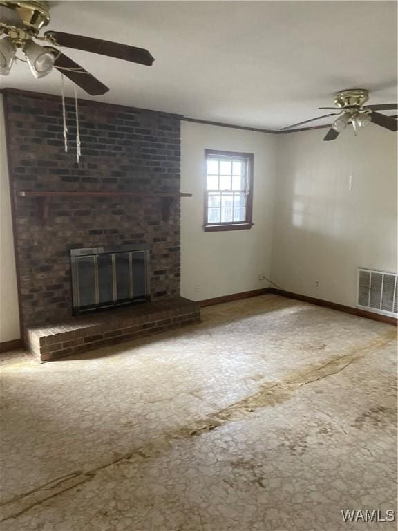 unfurnished living room featuring ceiling fan and a fireplace