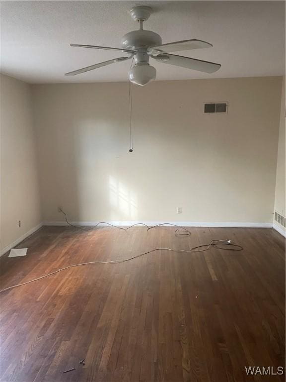 spare room featuring dark hardwood / wood-style floors