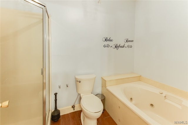 bathroom with hardwood / wood-style floors, toilet, and shower with separate bathtub