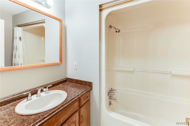 bathroom featuring vanity, shower / bath combination with curtain, and a textured ceiling