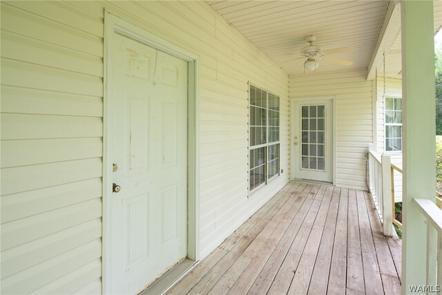 wooden deck with ceiling fan