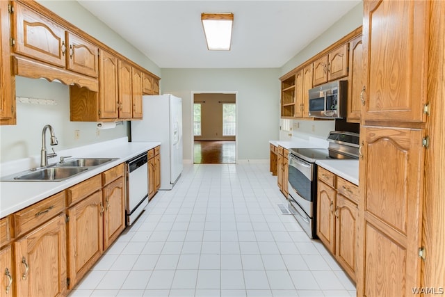 kitchen with appliances with stainless steel finishes and sink