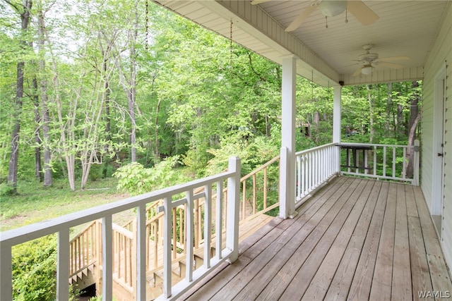 wooden deck featuring ceiling fan