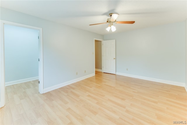 unfurnished room featuring ceiling fan and light hardwood / wood-style flooring