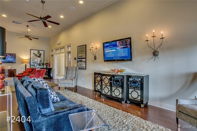 living room featuring recessed lighting, visible vents, and baseboards