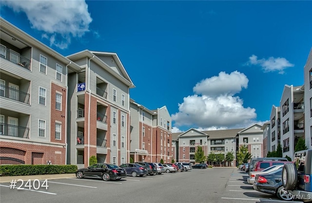 view of property with uncovered parking