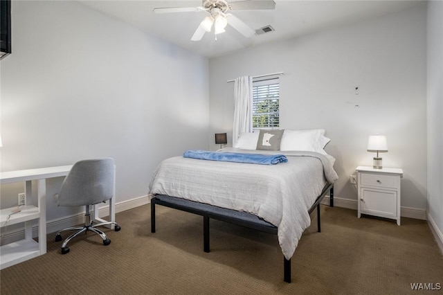 carpeted bedroom with baseboards, visible vents, and a ceiling fan