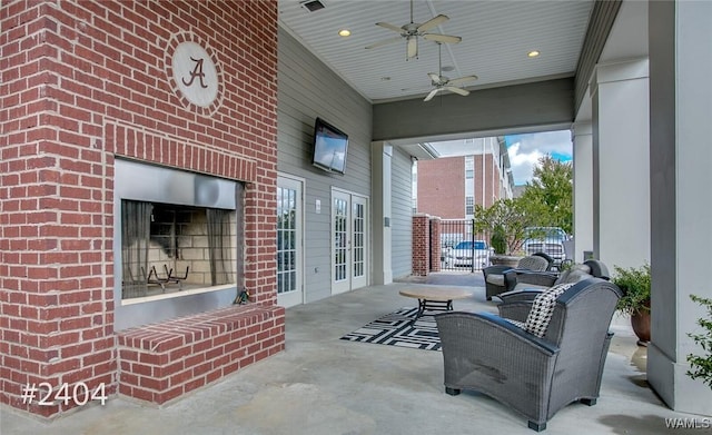 view of patio / terrace with a ceiling fan, visible vents, and fence