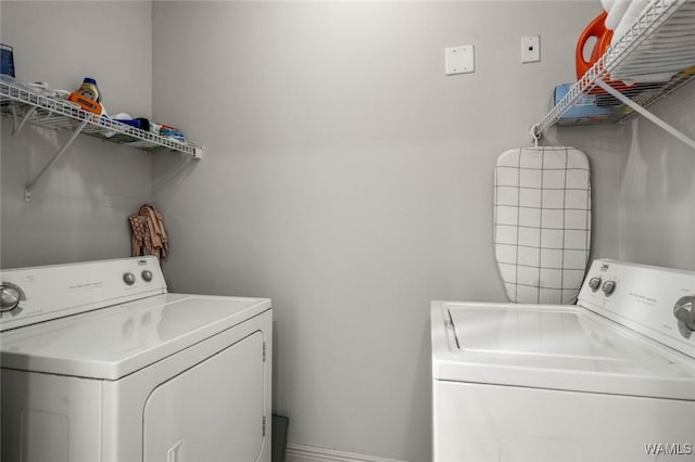 laundry area featuring laundry area and washer and clothes dryer